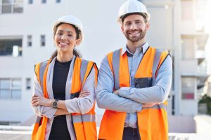 Proud portrait of engineering people in outdoor, construction site, development or project management mindset. Architecture, contractor or builder woman and partner in building or industry leadership.